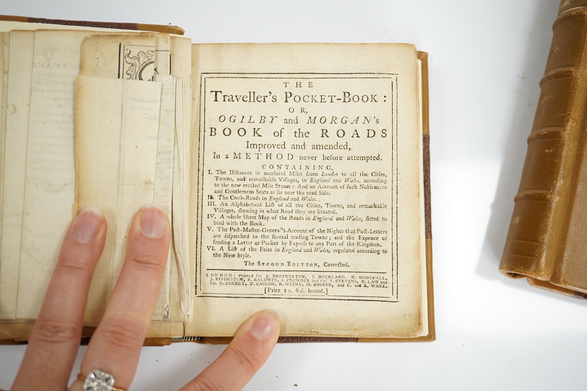 The Traveller's Pocket Book: or, Ogilby and Morgan's Book of Roads improved and amended ... the second edition, corrected. folded map (pictorial engraved title and a reference key with cartouche surround); newly rebound